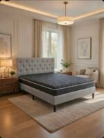 Lova su pilko lino medžiagos apdaila ir čiužiniu